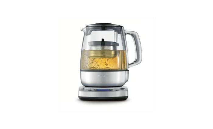 Breville tea maker basket steeping loose leaf tea in a glass carafe